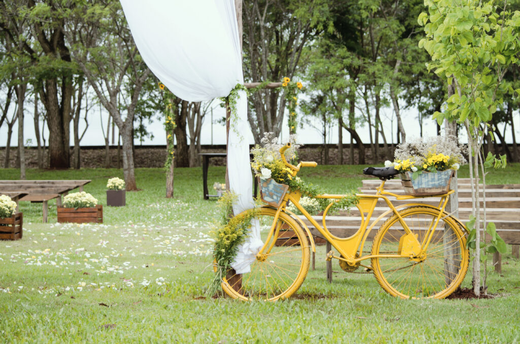 Decorated yellow bicycle in the beautiful park